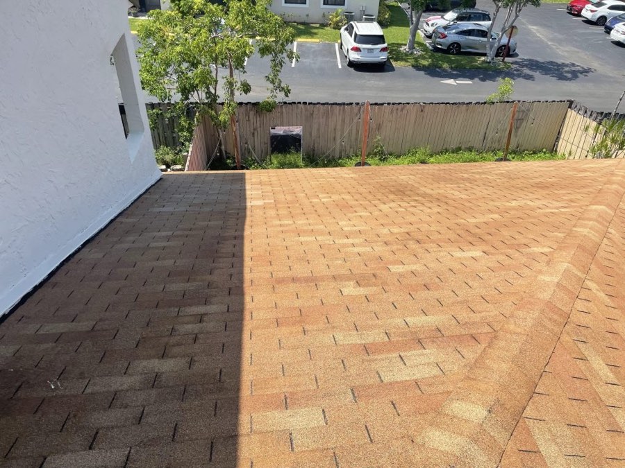 Shingle roof half cleaned — dirty side vs clean side
